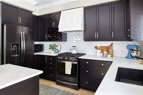 cream colored kitchen cabinets with black stainless steel appliances|black stainless steel color cabinets.